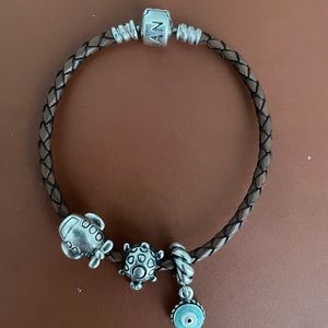 Brown Pandora Bracelet with three charms.
